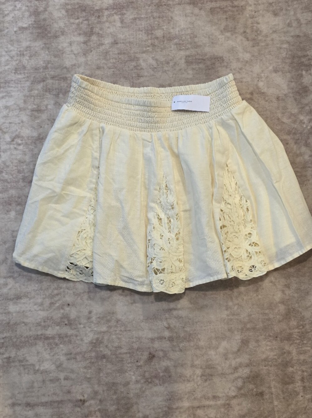 American Eagle Outfitters Pale Yellow Smocked Mini Skirt Medium